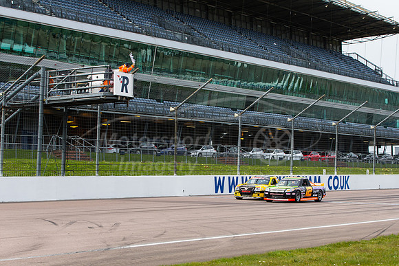 Paul Tompkins takes the flag for victory in race 13